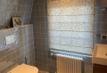 Badkamer met handvorm- en terrazzotegels